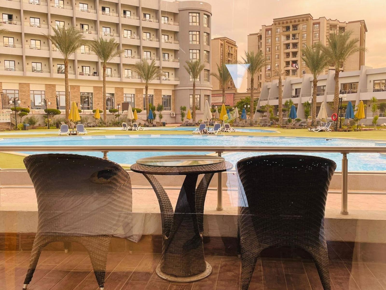 Jewel Sport City And Aqua Park Cairo Exterior photo View of the pool at the Grand Pyramids Hotel