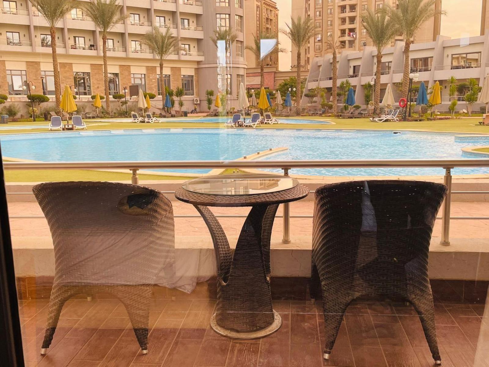 Jewel Sport City And Aqua Park Cairo Exterior photo View of the pool from a hotel room