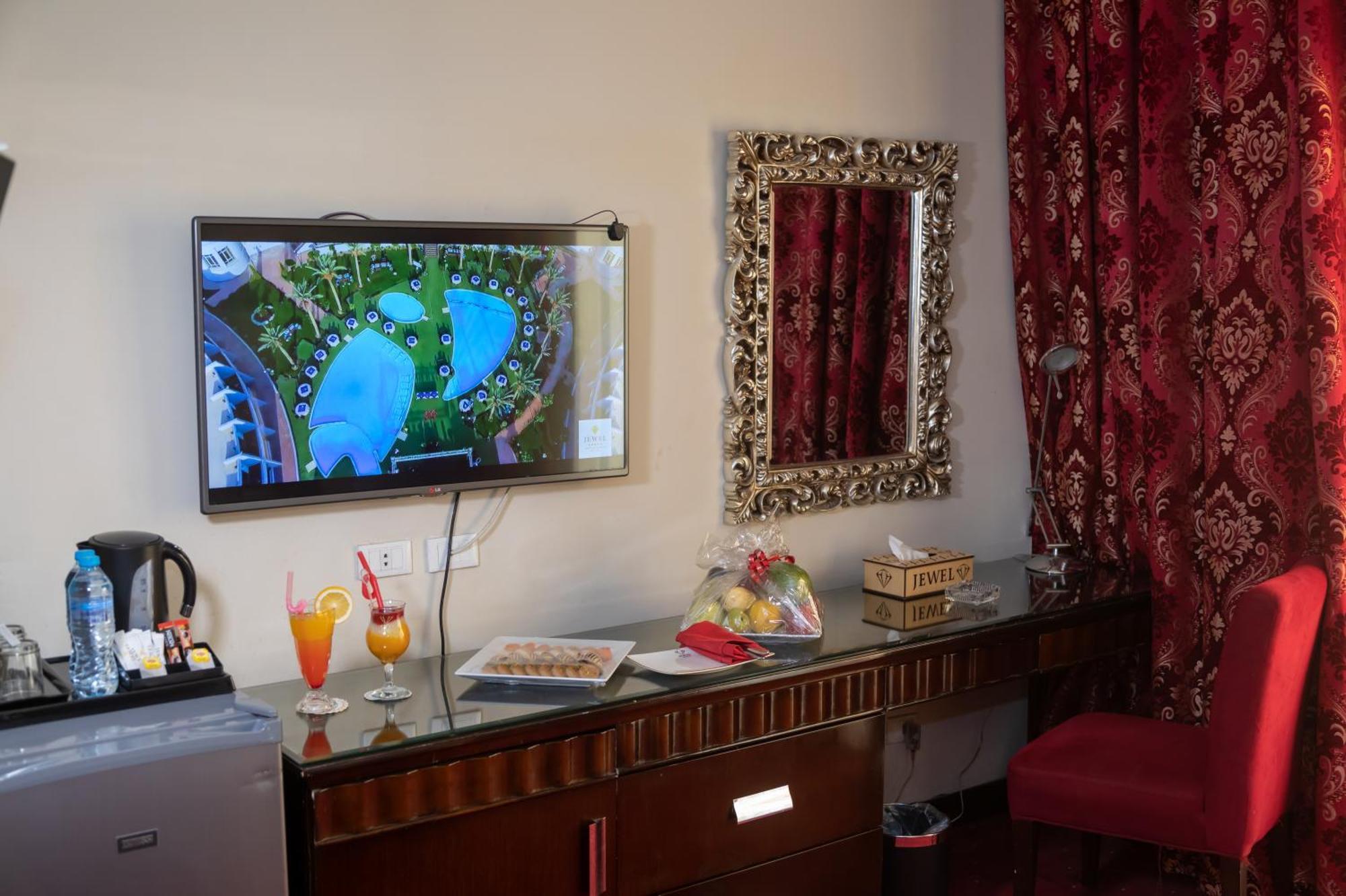Jewel Sport City And Aqua Park Cairo Exterior photo A television set in a hotel room